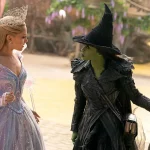 Wicked For Good review key art of Elphaba and Glinda